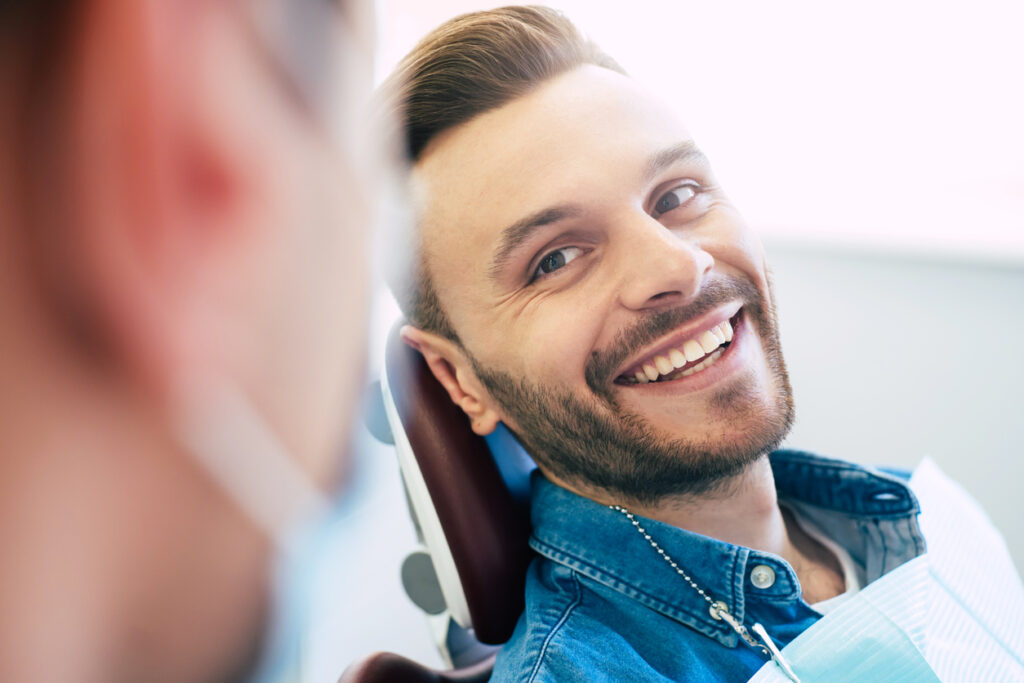 A perfect result of a dentist’s work which is seen in the beautiful and white smile on a patient who is absolutely satisfied with a result of a treatment given in a clinic.