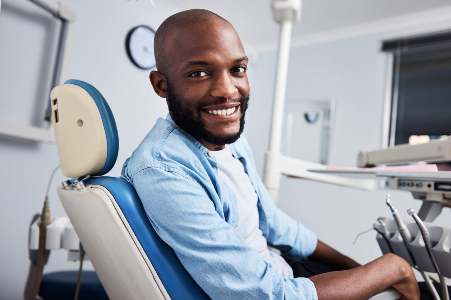 Handsome man smiling in the treatment chair at his orthodontic appointment