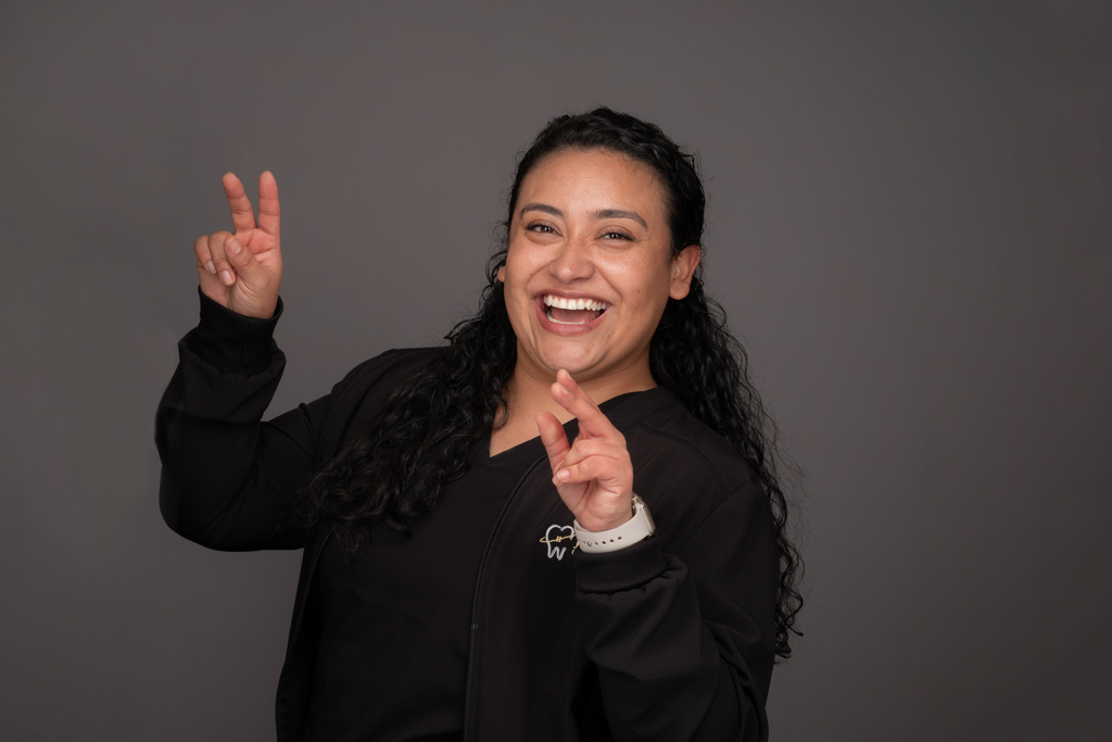 Smiling Prose Orthodontics Staff Member On Gray Background